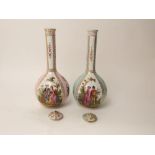 A matched pair of 19th century Dresden bottle shaped vases and covers, both with alternating