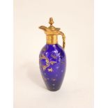 19th century blue glass ovoid claret jug with gilt metal spout and handle and further gilt