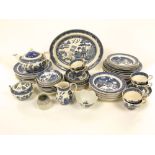 A quantity of Wedgwood blue and white printed willow pattern dinner and teawares including 14 dinner