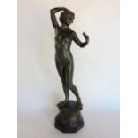 A French cast spelter figure of a nude Grace with wreath in her hair holding a flower, 41 cm high