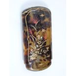 A Japanese simulated tortoiseshell cigar pouch with gilded lacquered finish, signed