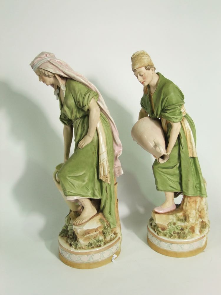 A pair of large early 20th century Royal Dux figures of male and female water carriers, both in - Image 2 of 4