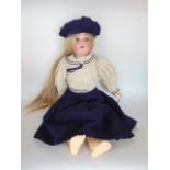 A bisque headed doll with open mouth with teeth, articulated wooden limbs and sailor suit, 52 cm
