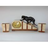 Art deco marble figural mount mantle clock, the stylised clock mounted by a spelter panther, with