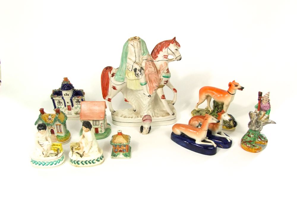 A collection of 19th century and later Staffordshire wares including a pair of figures of children