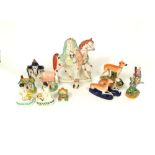 A collection of 19th century and later Staffordshire wares including a pair of figures of children