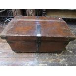 An antique tan leather clad and steel reinforced travelling trunk/chest with side carrying