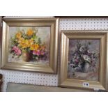 Two 20th century oil paintings on board of floral still lifes, both signed with monogram bottom left