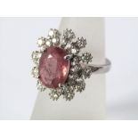 A pink ruby and diamond ring in 18ct white gold starburst design, size N, 7.5g