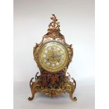 French two train boulle work and ormolu mantle clock, the two train 10cm gilt dial fitted with