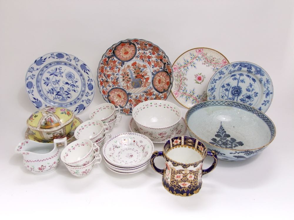 A collection of mainly 19th century ceramics including an imari charger, a continental tin glazed