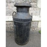 A vintage steel two handled milk churn and cap stamped South Coast Dairies Ltd