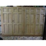 A large 19th century floorstanding side/housekeepers cupboard enclosed by two pairs of moulded multi