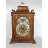 Antique style burr walnut veneered two train bracket clock, the architectural case with ormalu