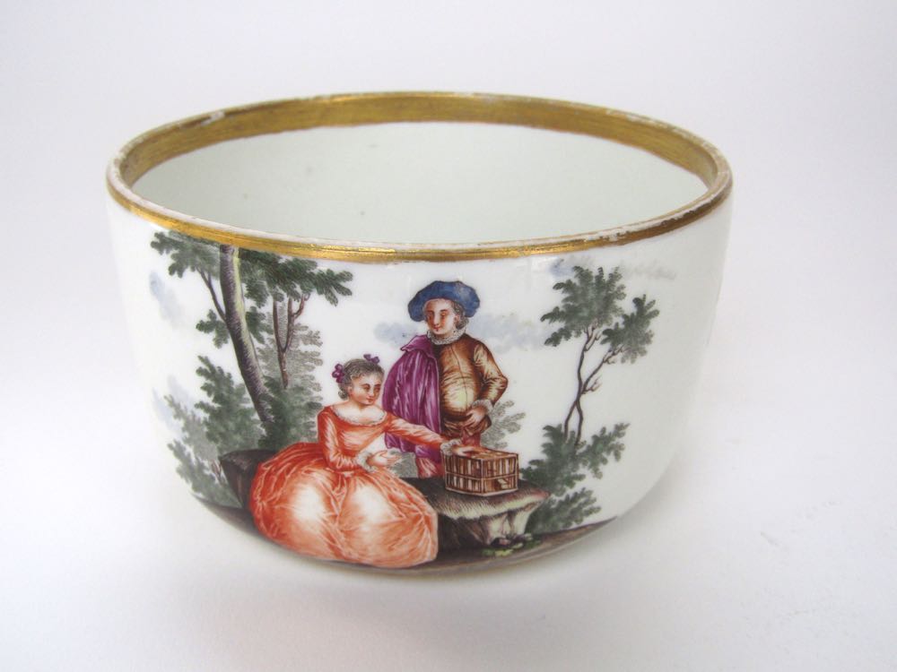 A good quality 19th century Meissen bowl of circular form with painted panels in a Watteauesque