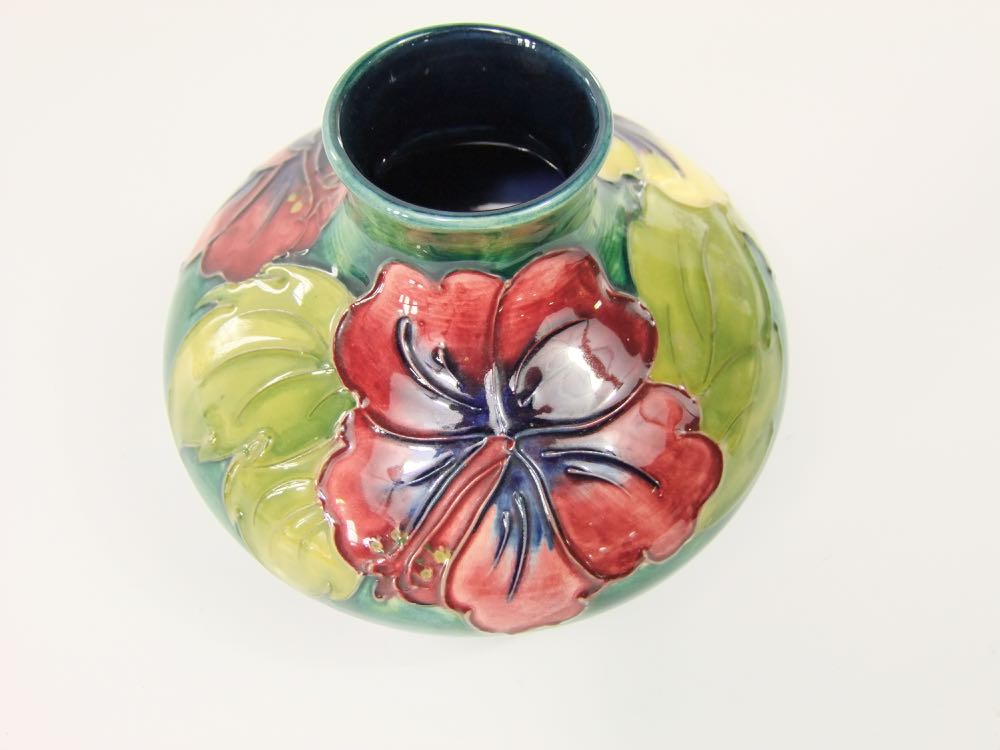 A Moorcroft vase of squat form with drawn neck and with raised and painted hibiscus decoration in - Image 2 of 3