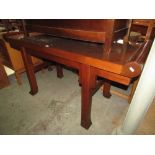 A Chinese hardwood altar table of usual rectangular form with scrolled ends on square cut