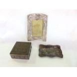 A Chinese pewter photograph frame with dragon detail; together with a dish and trinket box of