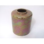 A Ruskin pottery vase of cylindrical form with speckled brown glaze and with impressed marks to base