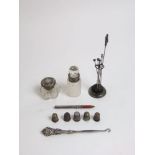 A mixed collection of bijouterie silver and white metal to include four thimbles, silver mounted