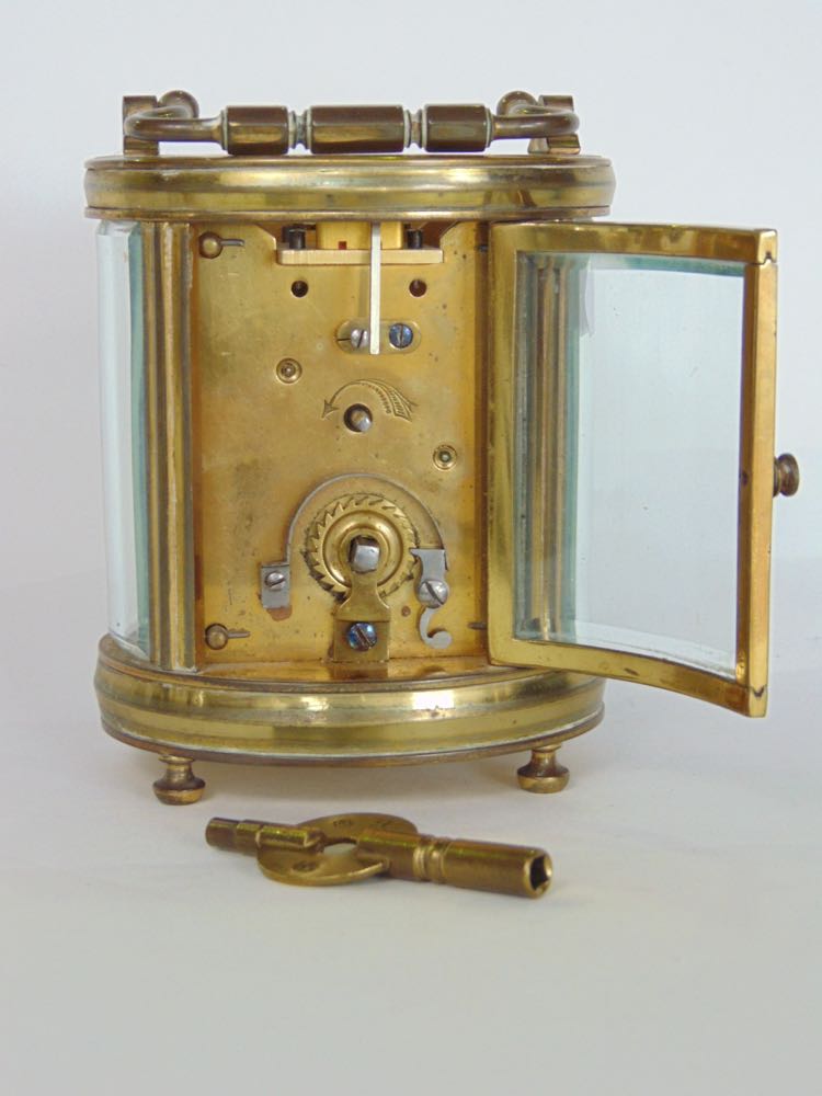 Good 19th century oval brass carriage clock fitted with a circualr enamelled dial on a gilt plate, - Image 3 of 3