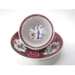 A 19th century Chinese eggshell porcelain tea bowl and saucer with famille rose floral figural