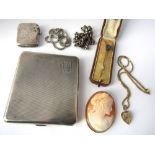 A mixed lot comprising silver cigarette case and vesta, two silver chains, cameo brooch in yellow