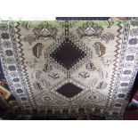 A Persian style floral runner decorated with brown medallions and flower heads upon a fawn ground,