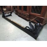 A 19th century cast iron brass moulded fire curb with Welsh Dragon corners, 140cm by 38cm exterior