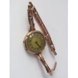 A vintage 9ct lughead rose gold bracelet watch with 9ct sprung strap