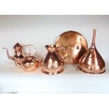 A mixed collection of antique polished copperware to include a large funnel, copper kettle,