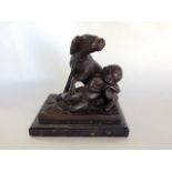 A cast bronze study of a sleeping girl and a hound upon a black marble base, 16 cm high approx.