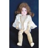 A bisque headed doll by Valkare of Germany with closing eyes, open mouth, dimpled chin and
