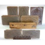 A box containing a collection of antique oak and other carved wooden panels together with a