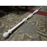 Three cream painted "florentine" wooden curtain poles with hand painted detail, two 200 cm long x 30