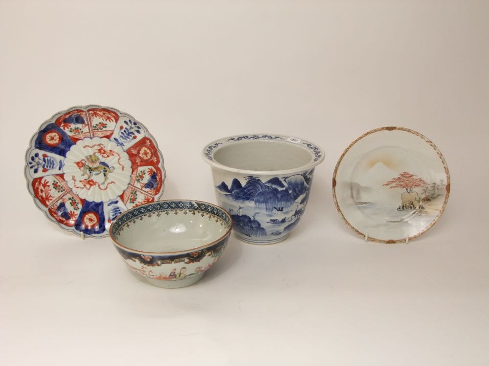 A collection of oriental ceramics including a blue and white painted cache pot with painted