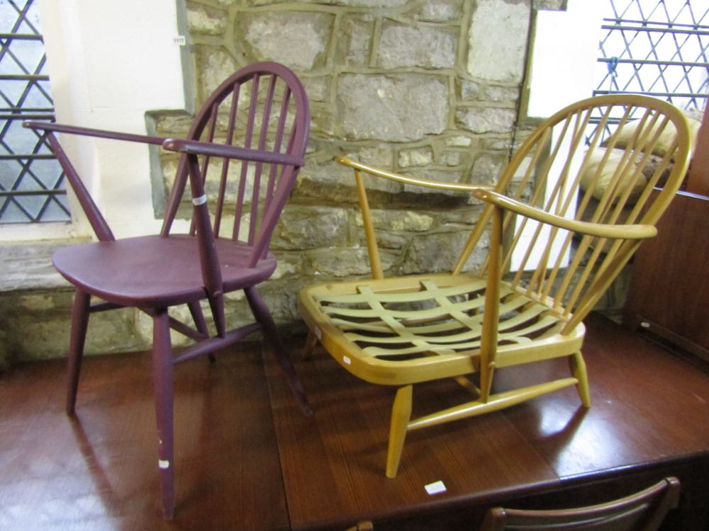 An Ercol light elm stick back lounge chair together with a further painted Ercol chair (2).