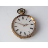 14ct Swiss fob watch with enamelled face and gilt markers and Roman numerals, the case stamped