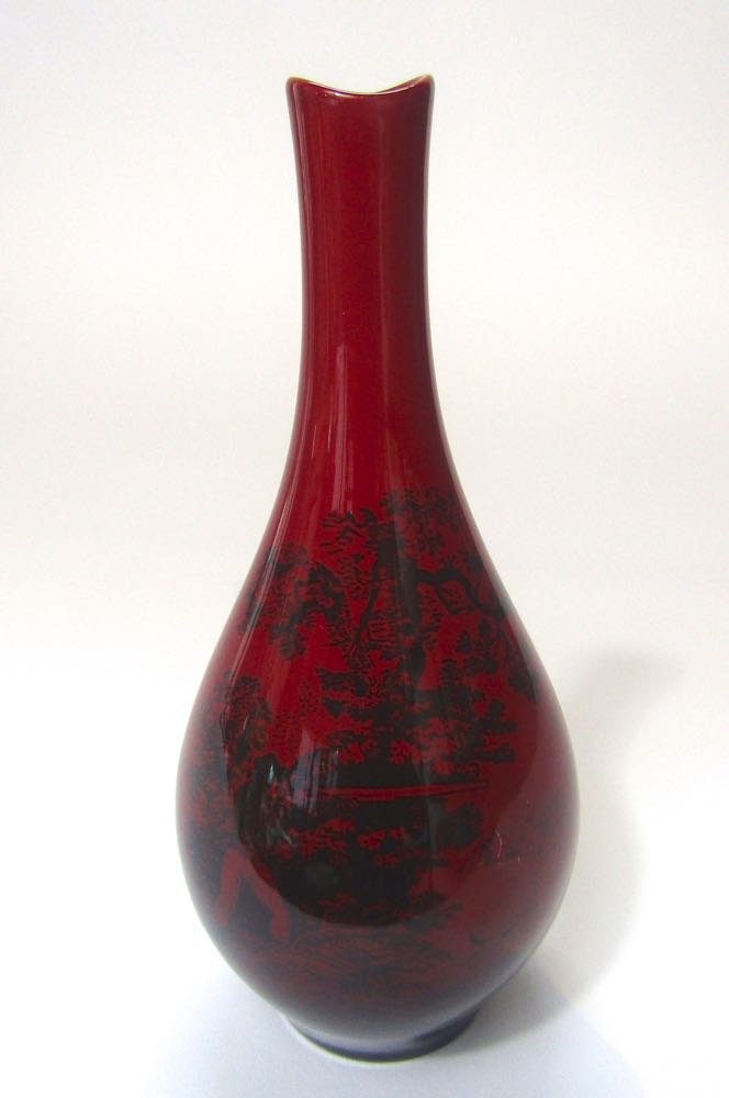 A Royal Doulton flambe vase with drawn neck in the Woodcut pattern number 1612, printed impressed