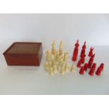 A good quality carved ivory part chess set within a mahogany games box, hight of King 10 cm