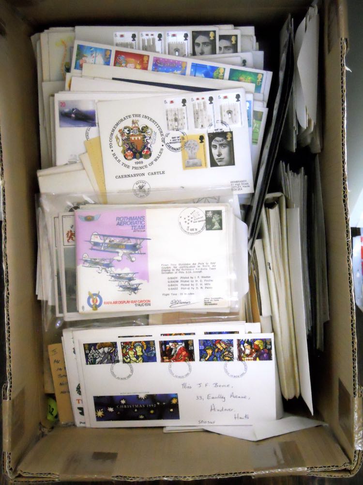 A box with a large quantity of GB and world stamps on covers