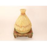 A 19th century George Jones majolica cheese dish and stand in the form of a wheatsheaf with