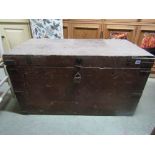 A substantial 19th century pine and steel banded travelling trunk with iron carrying handles