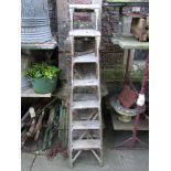 A vintage Hatherley pine folding step ladder together with one other, (to be sold for decorative