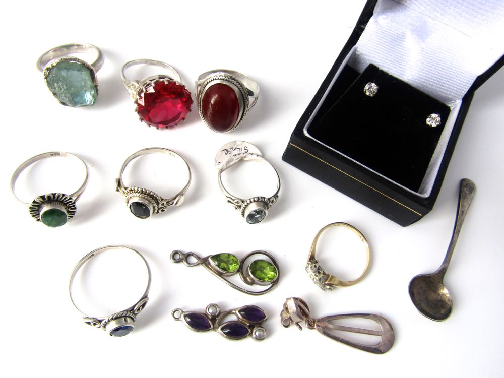 A collection of semi precious stones together with a quantity of silver gem set jewellery and a pair