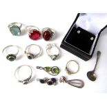 A collection of semi precious stones together with a quantity of silver gem set jewellery and a pair