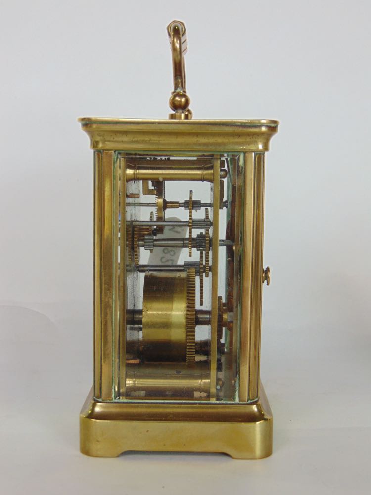 Brass carriage clock in cornice case with enamelled dial, the back plate engraved with a striding - Image 2 of 3
