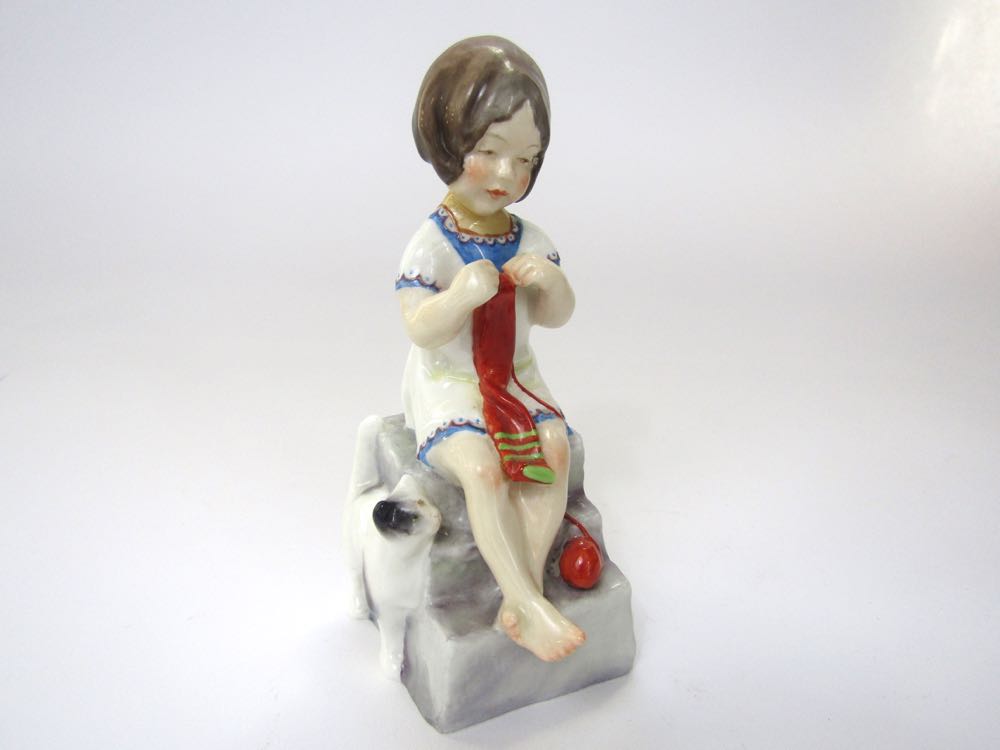 A Royal Worcester figure of Saturday's Child Works Hard For a Living in the form of a little girl