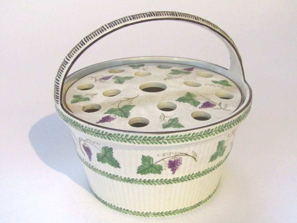 A late 19th century Wedgwood creamware type pot pourri basket of circular form with ridge moulding