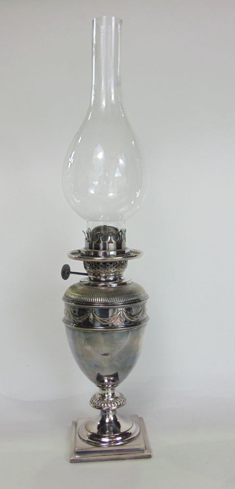 Good quality silver plated baluster oil lamp with embossed ribbon band, 26cm high